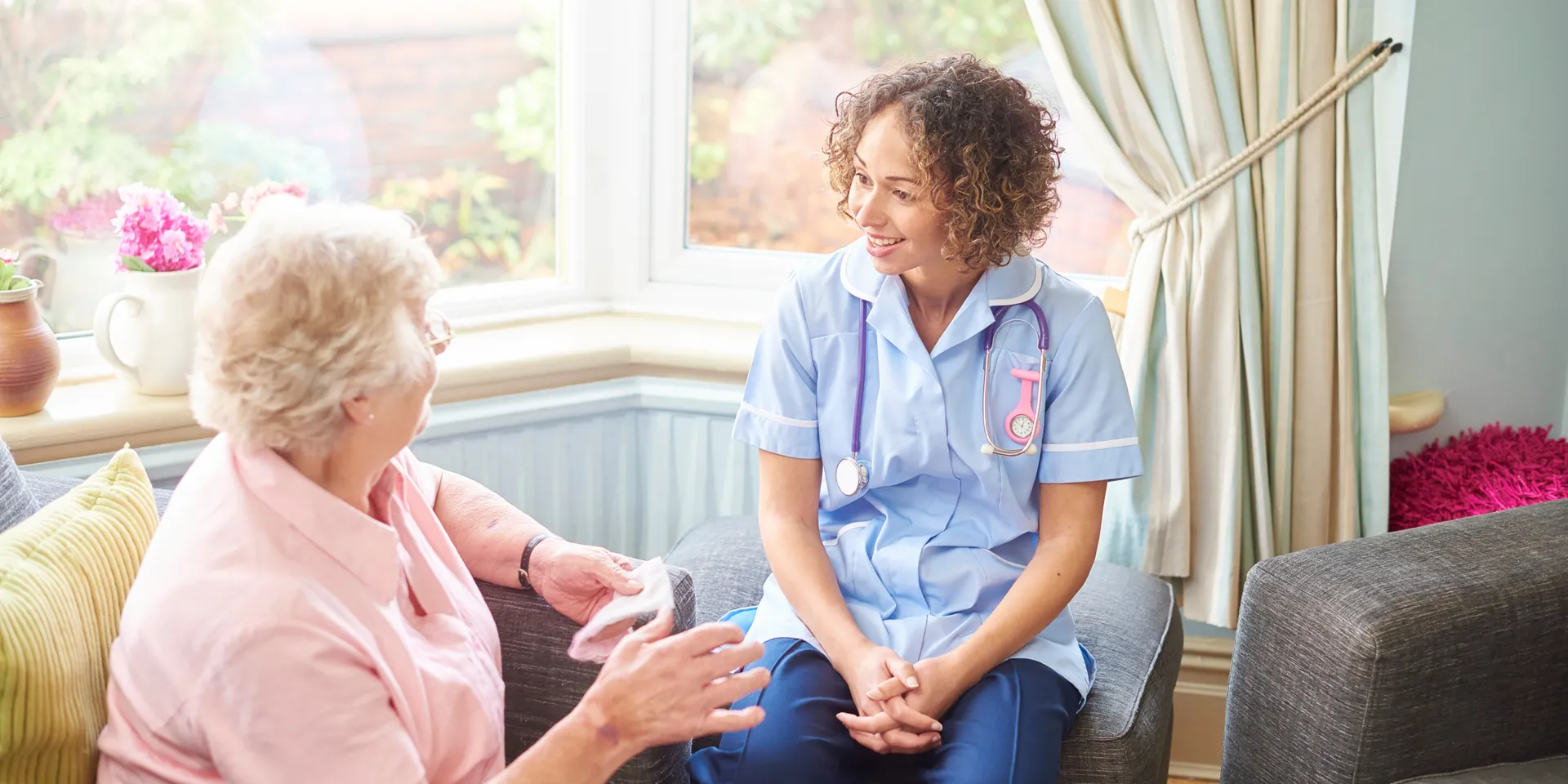 Caregiver assisting an older adult at home in Garner, NC